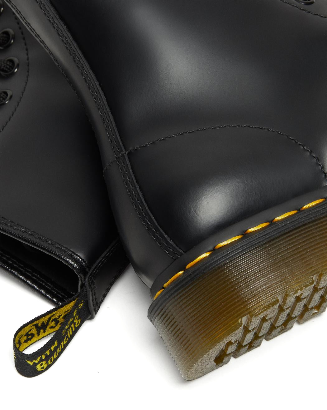 A mid-ankle height, laced, black leather boot.