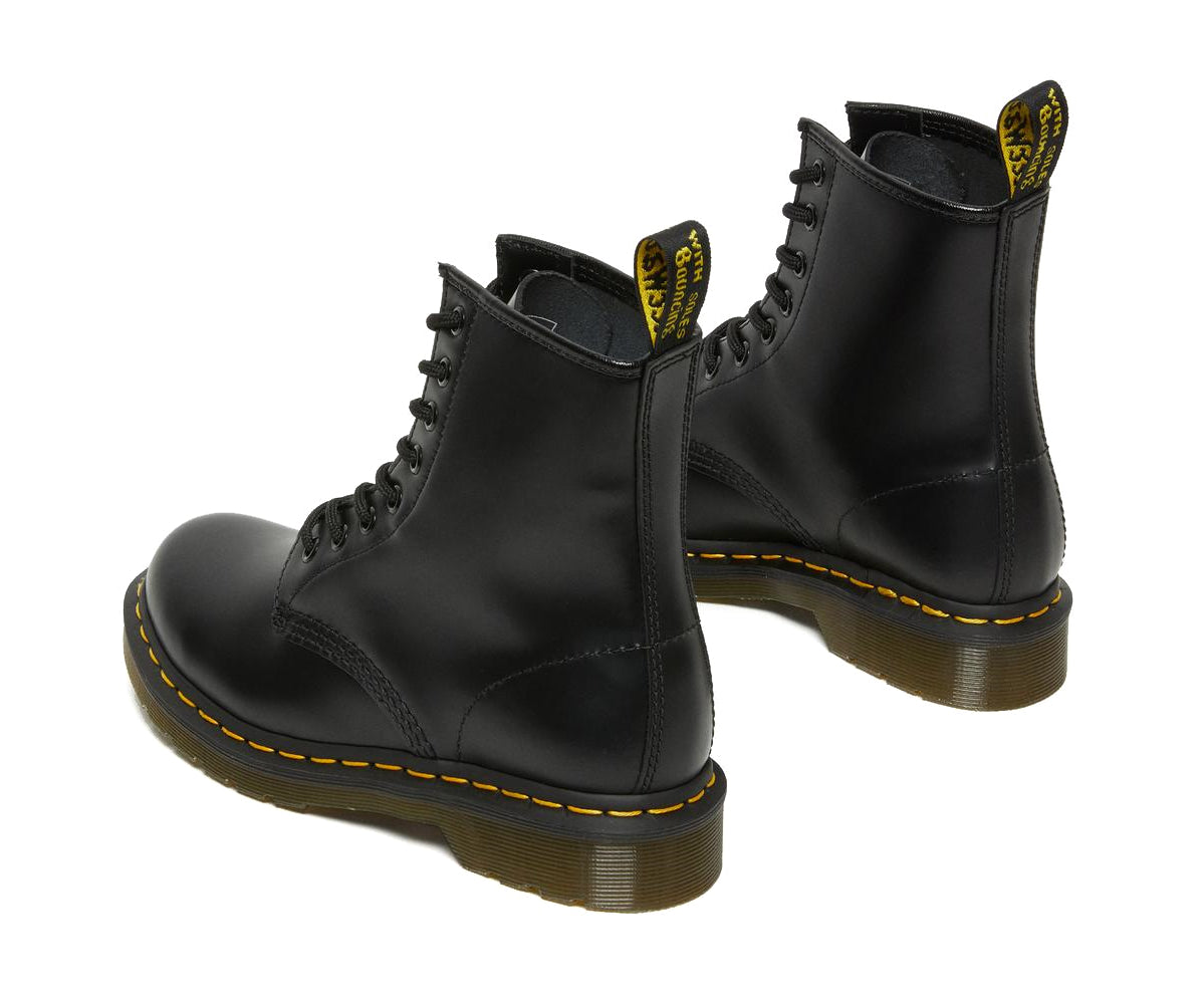 A mid-ankle height, laced, black leather boot.