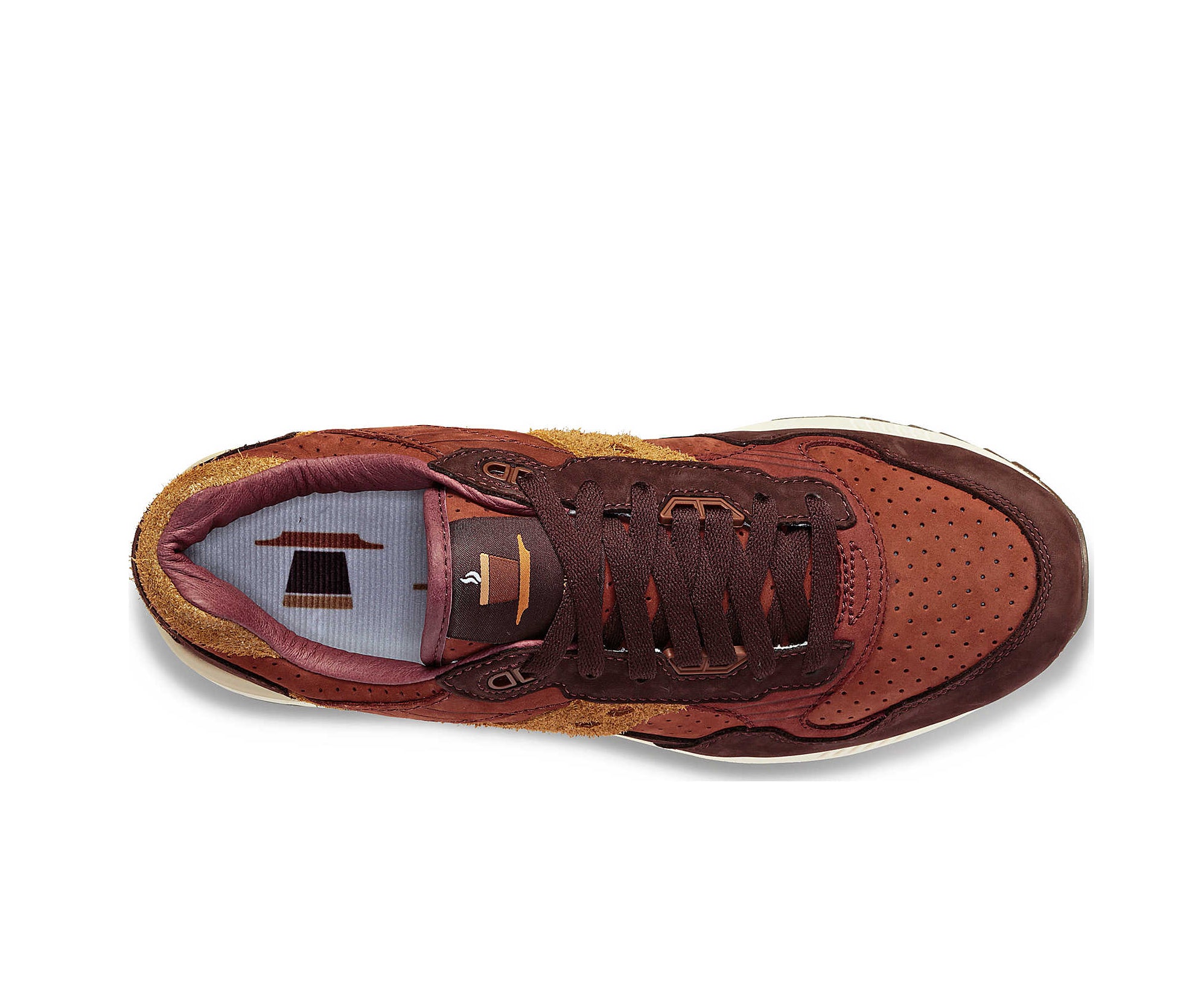 A suede low-cut Saucony sneaker in various shades of rich brown.