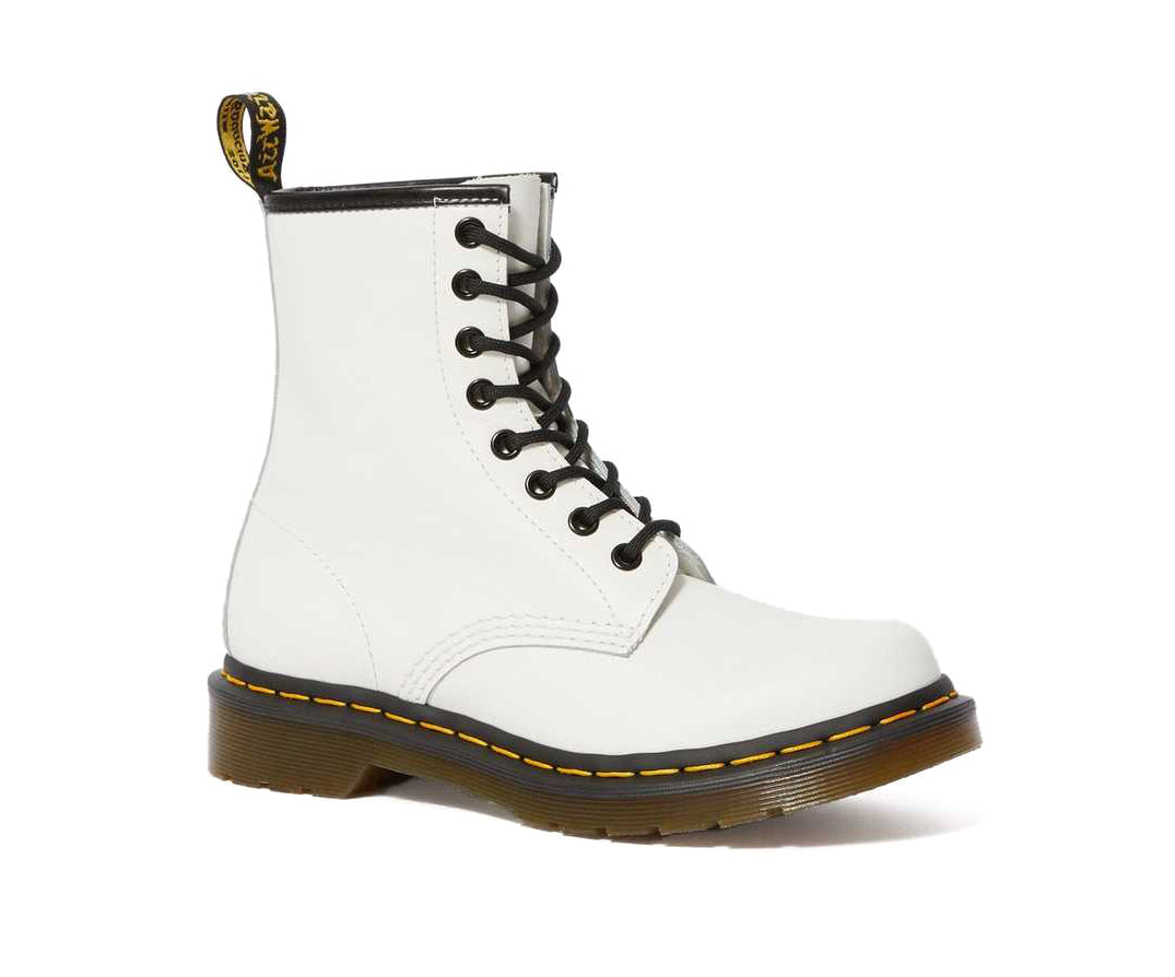 A white leather Dr. Martens ankle boot.