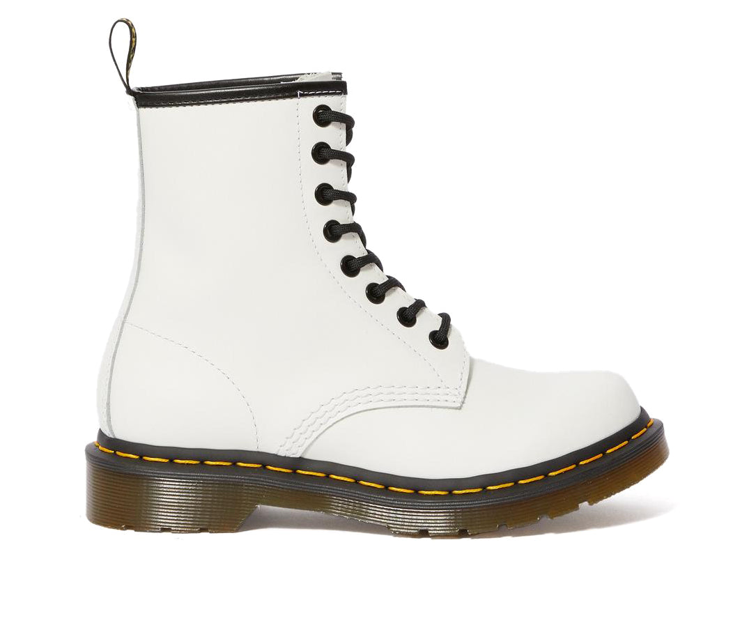 A white leather Dr. Martens ankle boot.