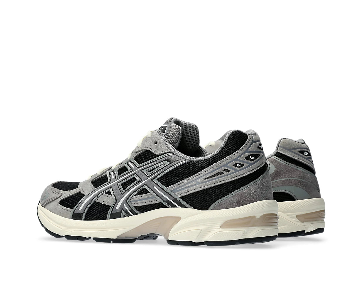 A black and gray running shoe from ASICS.