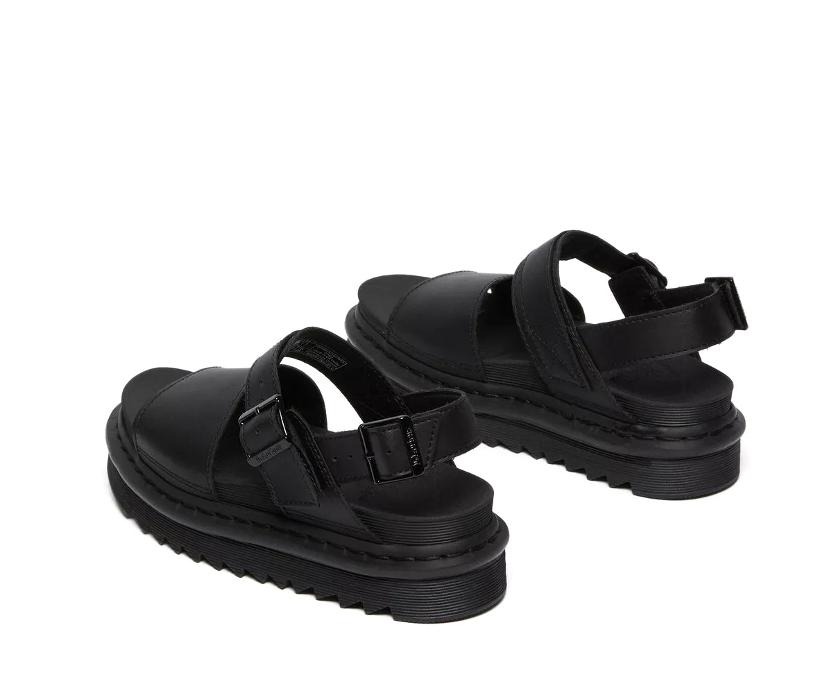 A monochrome black vegan leather Dr. Martens sandal.