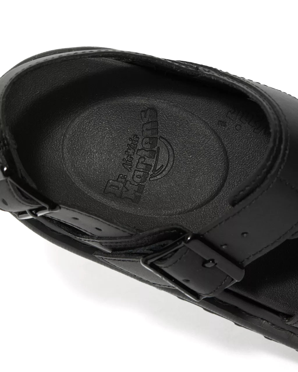 A monochrome black vegan leather Dr. Martens sandal.