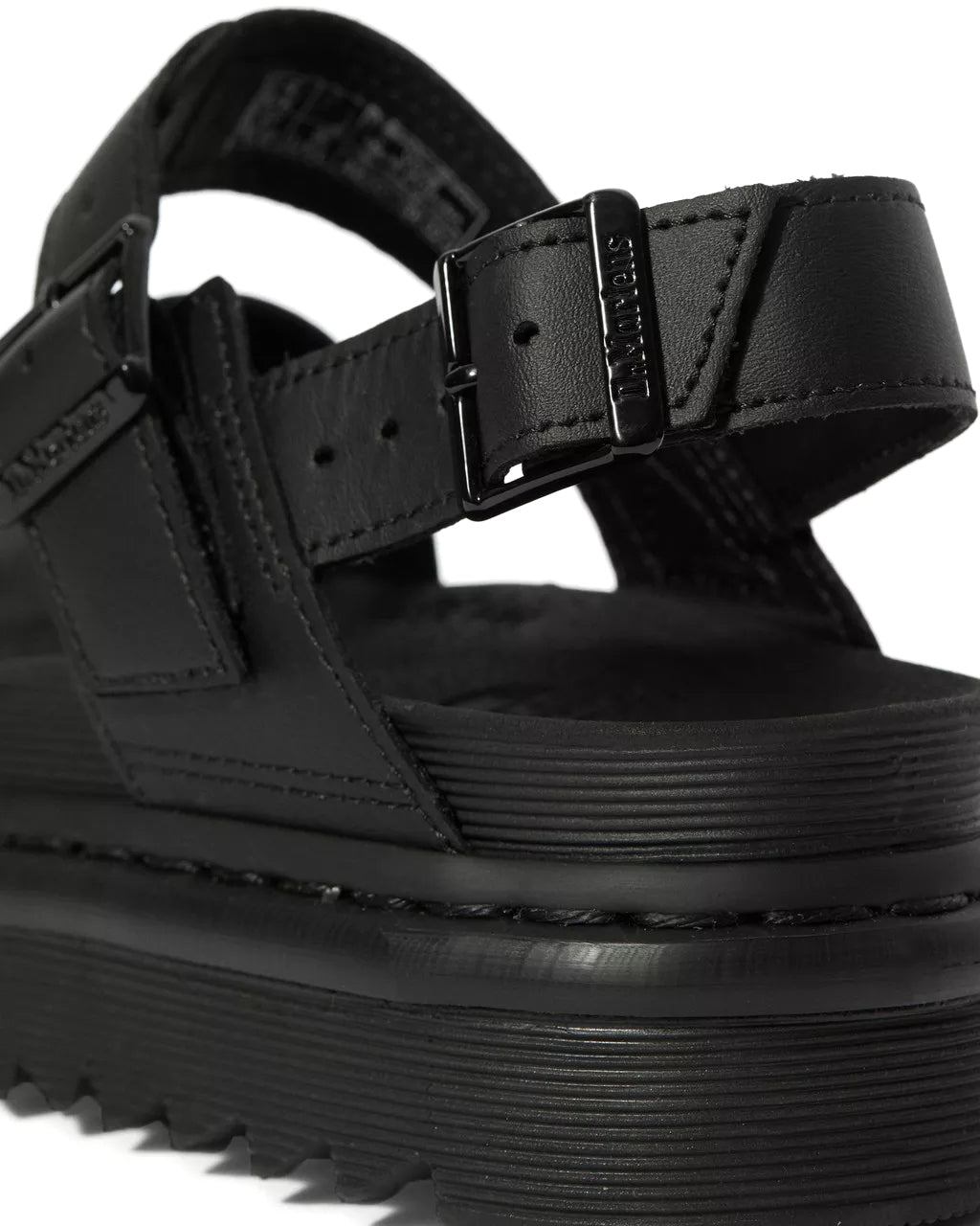 A monochrome black vegan leather Dr. Martens sandal.