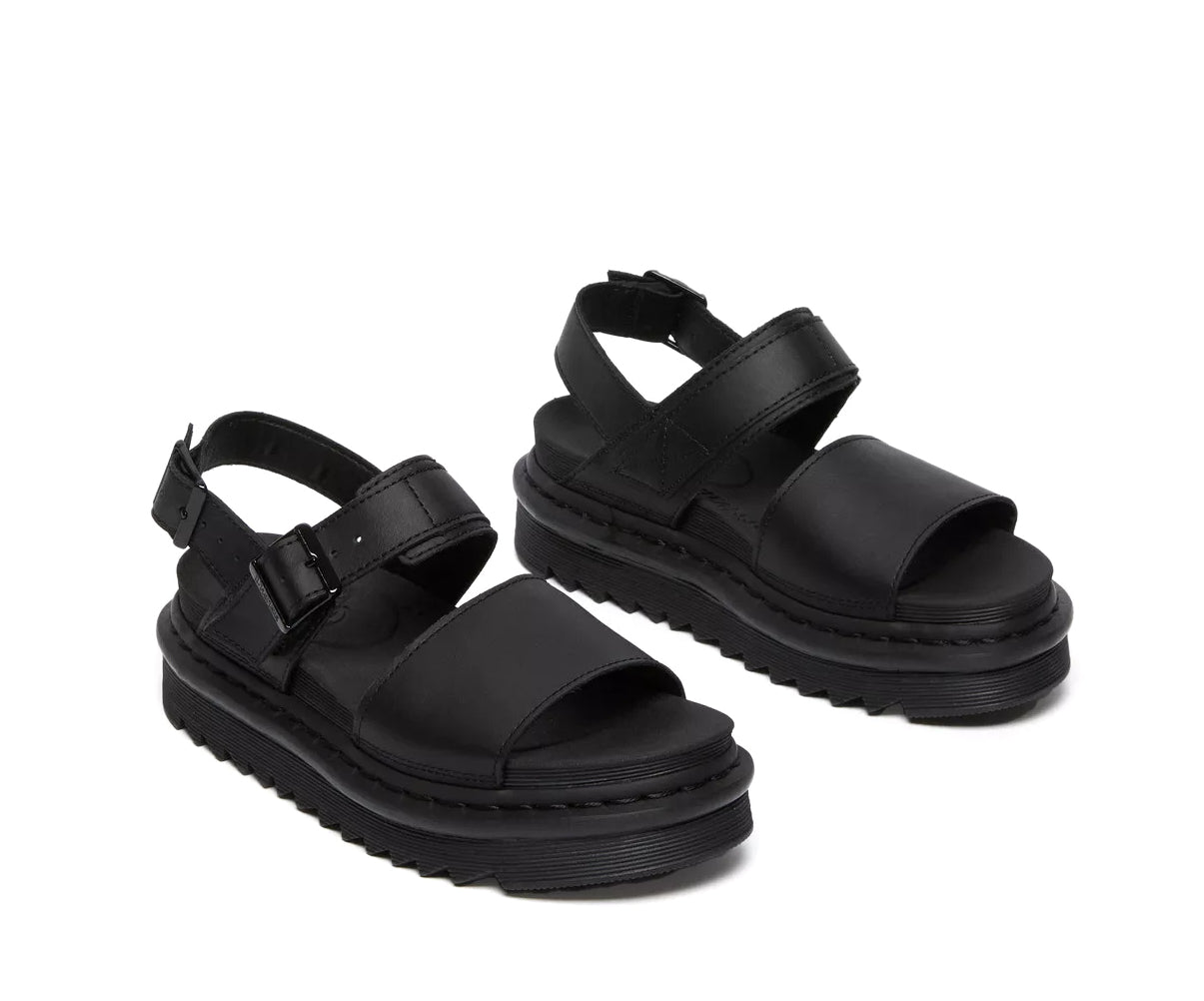 A monochrome black vegan leather Dr. Martens sandal.