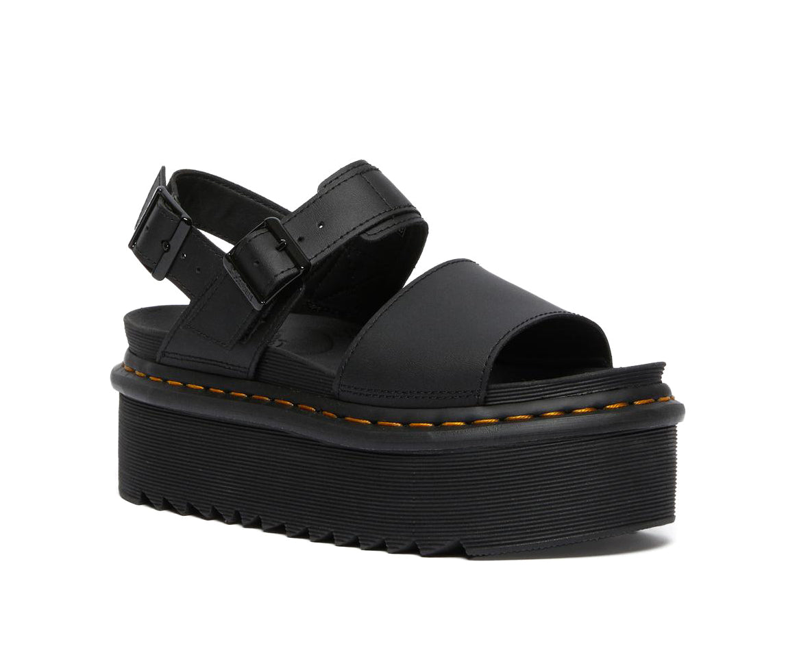 A black leather platform Dr. Martens sandal.