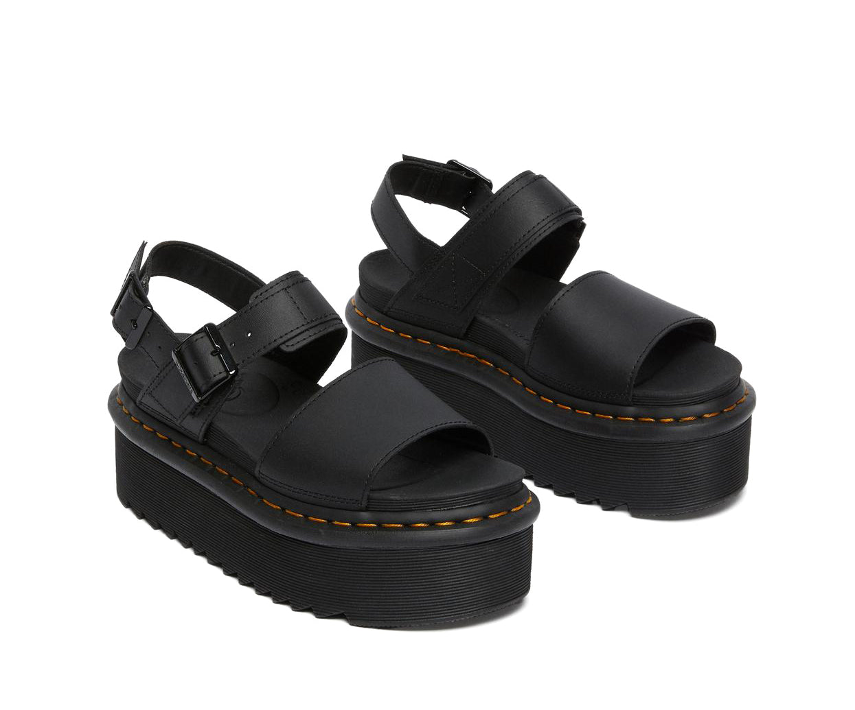 A black leather platform Dr. Martens sandal.