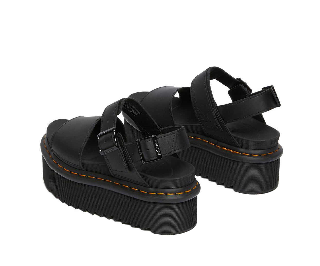 A black leather platform Dr. Martens sandal.