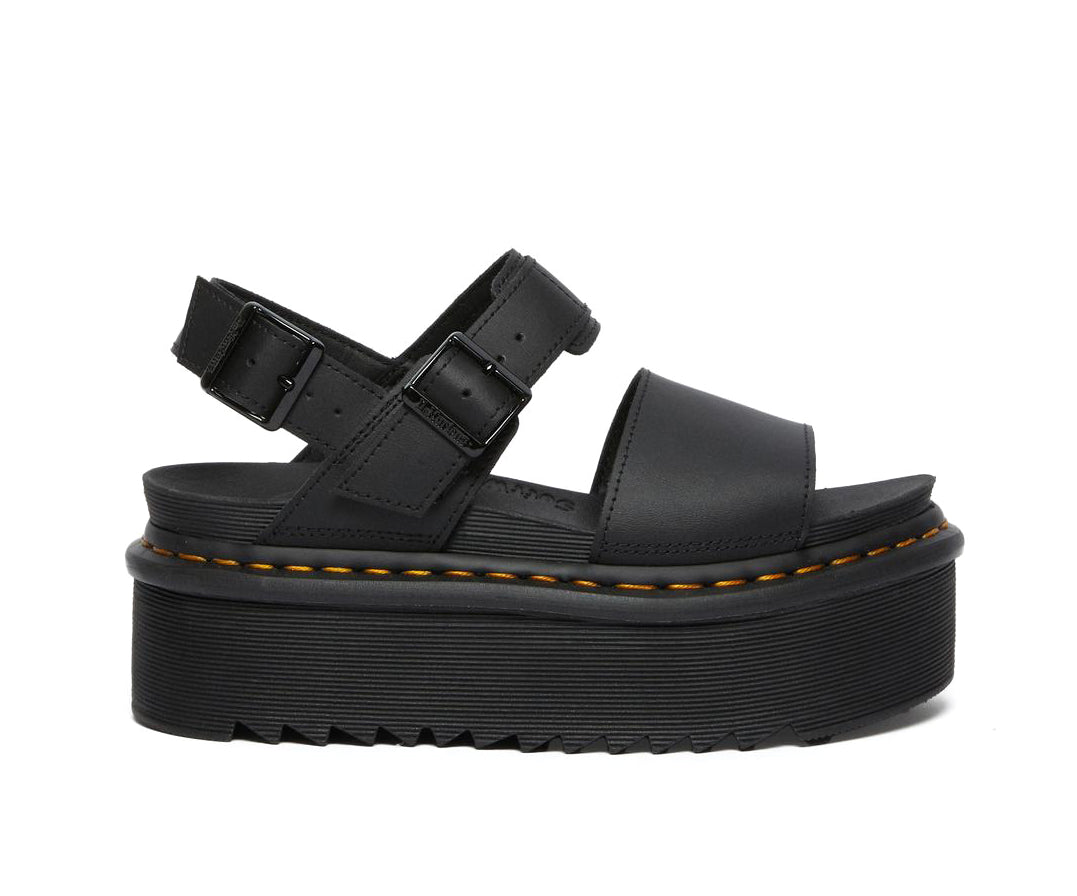 A black leather platform Dr. Martens sandal.