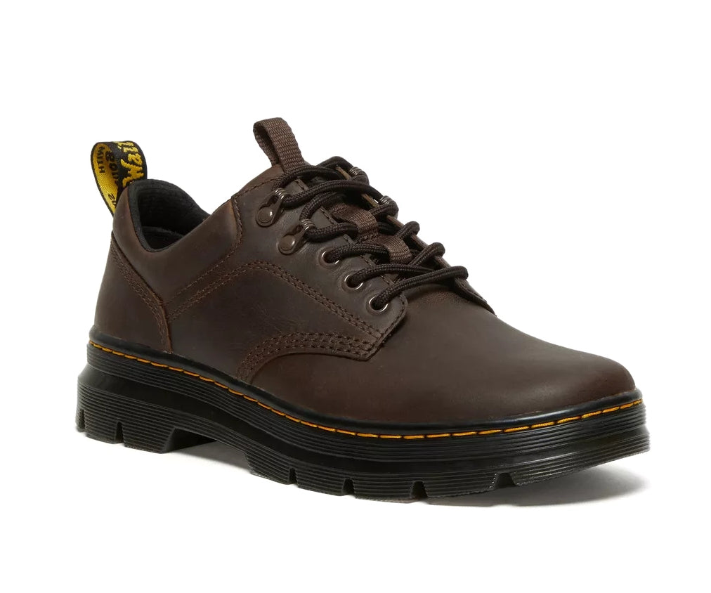 A dark brown leather shoe from Dr. Martens.