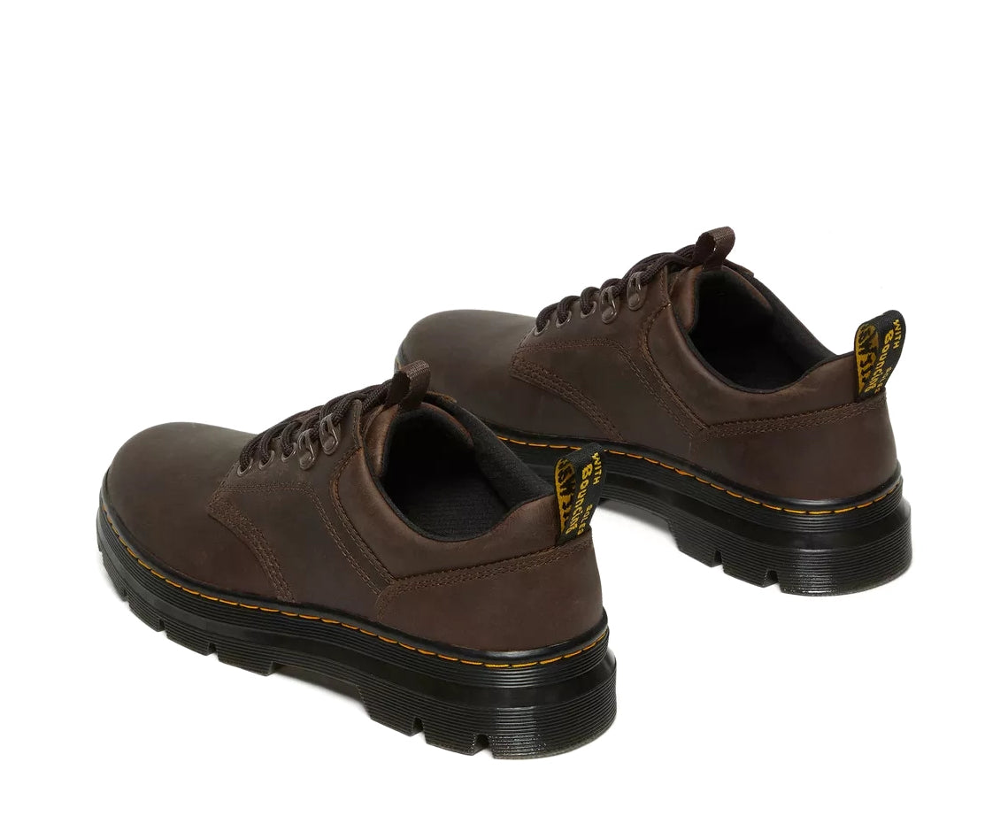 A dark brown leather shoe from Dr. Martens.