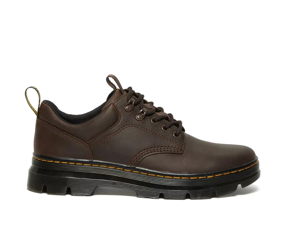 A dark brown leather shoe from Dr. Martens.