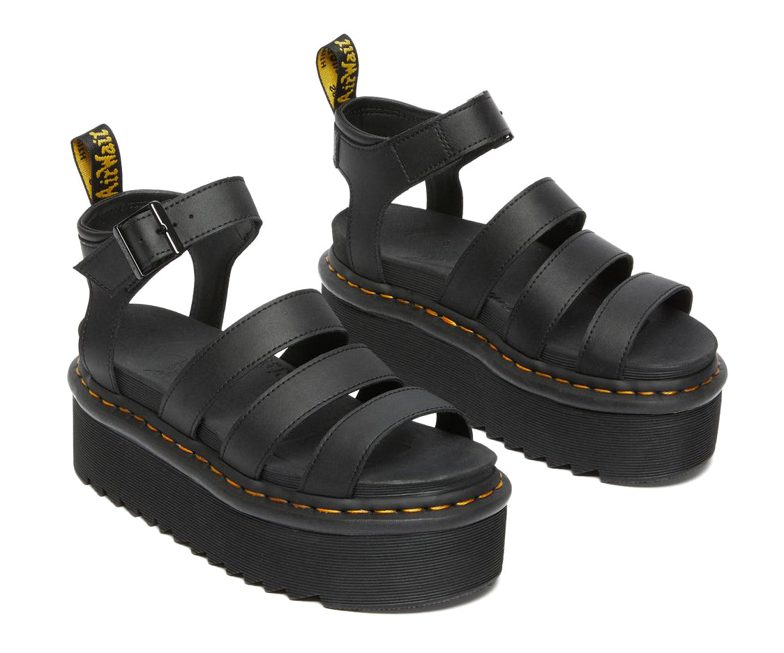 A black platform 3-strap sandal with ankle buckle from Dr. Martens.