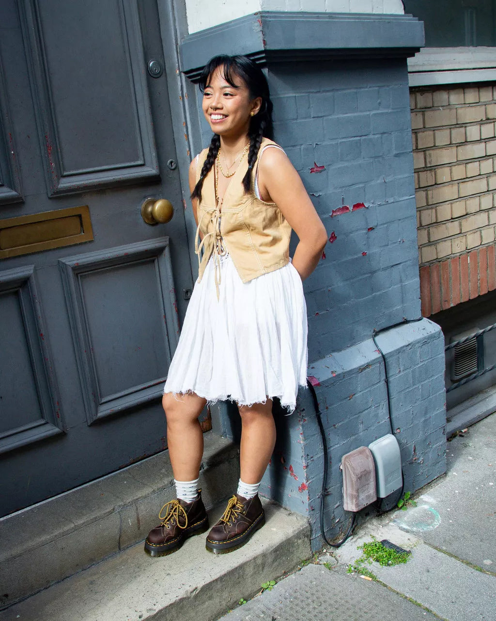 A demo of a dark brown leather chukka boot with yellow stitch accents from Dr. Martens.