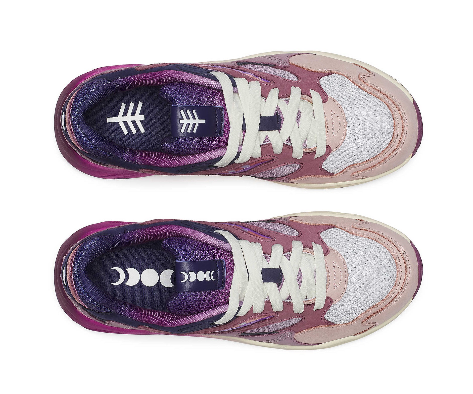 A purple sneaker from Saucony with dark blue accents and a magenta to white gradient.