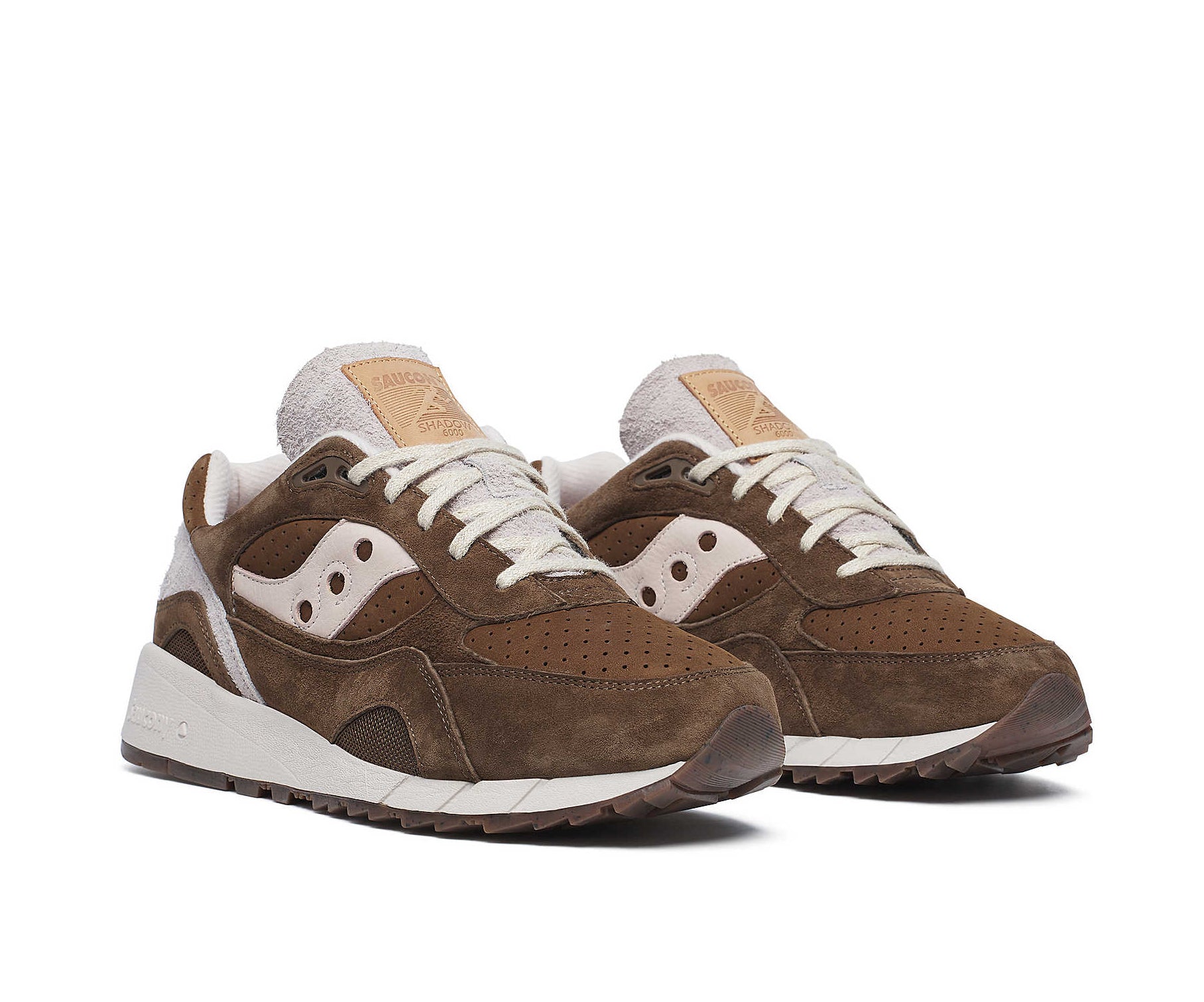 A brown suede sneaker with light cream accents from Saucony.